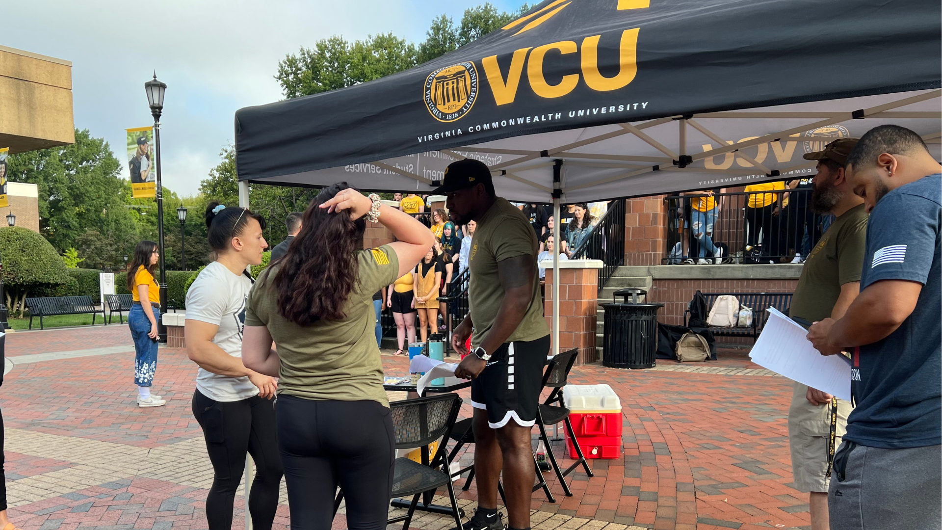 Students gathering for military-related events outside the commons.